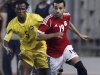 Egypt's Mohamed Salah fights for the ball with Mozambique's Martinho Mucana during their 2014 World Cup Brazil qualifying soccer match at Borg El Arab "Army Stadium"