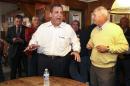 New Jersey Gov. Chris Christie, left, campaigns with Republican gubernatorial candidate Walt Havenstein, right, at a VFW hall in Lancaster, N.H., Friday, Oct. 10, 2014. Christie, visiting New Hampshire for the fourth time, said the race is winnable for Havenstein, despite a recent University of New Hampshire poll that shows him trailing Democratic Gov. Maggie Hassan by 10 points. (AP Photo/Cheryl Senter)