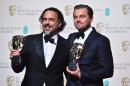 Actor Leonardo DiCaprio (R) poses with the award for best leading actor and Mexican director Alejandro Gonzalez Inarritu with his award for best director both for the film "The Revenant" at the BAFTAs on February 14, 2016