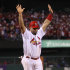 St. Louis Cardinals' Albert Pujols reacts as he scores during the first inning of Game 7 of baseball's World Series against the Texas Rangers  Friday, Oct. 28, 2011, in St. Louis. (AP Photo/Ezra Shaw, Pool)