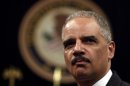 U.S. Attorney General Holder looks out during a special naturalization ceremony at the Department of Justice in Washington
