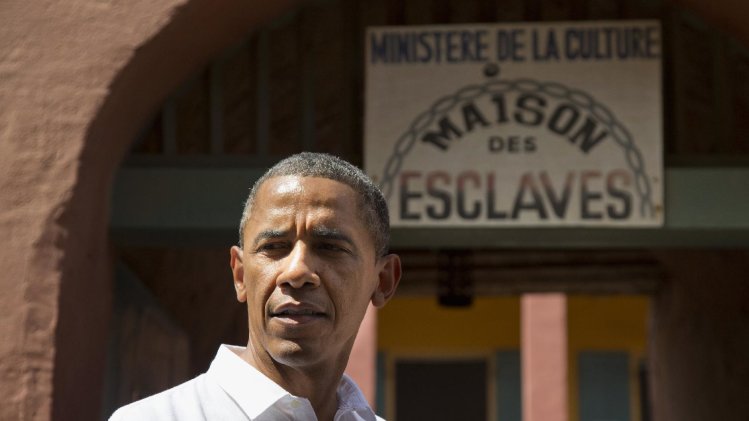 President Barack Obama pauses during a statement after taking a tour of Goree Island, Thursday, June 27, 2013, in Goree Island, Senegal. Goree Island is the site of the former slave house and embarkation point built by the Dutch in 1776, from which slaves were brought to the Americas. (AP Photo/Evan Vucci)