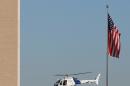 CORRECTS YEAR - A Department of Homeland Security helicopter flies over the El Paso VA and Beaumont Army Medical Center campus during the search for a gunman in El Paso, Texas on Tuesday, Jan. 6, 2015. (AP Photo/The El Paso Times, Victor Calzada)