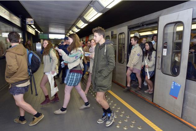 People take part in the annual "No Pants Subway Ride" in the subway in Brussels
