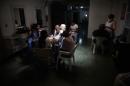 A hairdressing salon in the dark during a power cut in Caracas, on June 27, 2014
