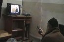 FILE - This undated image from video, seized from the walled compound of al-Qaida leader Osama bin Laden in Abbottabad, Pakistan, and released by the U.S. Department of Defense Saturday, May 7, 2011, shows a man, identified as Osama bin Laden, watching President Barack Obama on his television. Al-Qaida's image was a top concern on Osama bin Laden's mind in the last months of his life. In letters captured in the U.S. raid that killed him, the terror leader complains that al-Qaida branches kill too many Muslim civilians, turning the public against them. (AP Photo/Department of Defense, File)
