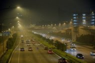 Motorists travel along the hazy Central Expressway in Singapore, on June 19, 2013. Singapore's smog crisis from forest fires in Indonesia reached near "hazardous" levels as the air pollutant index hit the highest level on record