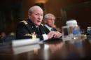 Chairman of the Joint Chiefs of Staff General Martin Dempsey (L) and Defense Secretary Chuck Hagel testify before the Senate Appropriations Committee's Defense Subcommittee on June 18, 2014 in Washington