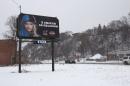 A billboard in Quebec reading "To each his own religion"