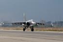 A Russian Sukhoi Su-25 bomber lands at the Russian Hmeimim military base in Latakia province, in the northwest of Syria, on December 16, 2015