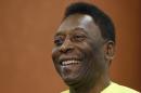 FILE - In this March 20, 2015, file photo, Brazilian soccer legend Pele smiles during a media opportunity at a restaurant in London. A Brazilian hospital says Pele is hospitalized in Sao Paulo. Mirtes Bogea, a press officer for the Albert Einstein hospital, said Saturday, July 18, 2015 she could only confirm Pele's hospitalization. She said she was not allowed to say when he was hospitalized or why. (AP Photo/Kirsty Wigglesworth,File)