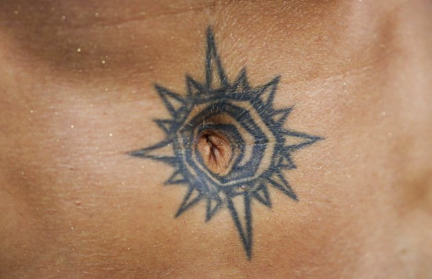 A tattoo is seen on the belly of Lalova of Bulgaria during the women's 200m event during the Golden Gala IAAF Diamond League at the Olympic stadium in Rome