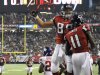 Atlanta Falcons tight end Tony Gonzalez (88) celebrates with wide receiver Julio Jones (11) after Jones scored a touchdown during the second half of an NFL football game against the New York Giants, Sunday, Dec. 16, 2012, in Atlanta. (AP Photo/Rich Addicks)