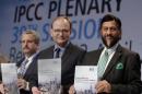 Ramon Pichs Madruga, Co-Chairman of the IPCC Working Group III, Ottmar Edenhofer, Co-Chairman of the IPCC Working Group III, and Rejendra K. Pachauri, Chairman of the IPCC, from left, pose prior to a press conference as part of a meeting of the Intergovernmental Panel on Climate Change (IPCC) in Berlin, Germany, Sunday, April 13, 2014. The panel met from April 7, 2014 until April 12, 2014 in the German capital. (AP Photo/Michael Sohn)