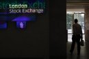 A man walks through the lobby of the London Stock Exchange