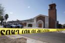 Police tape is stretched outside the Mater Misericordiae Mission Catholic church in Phoenix