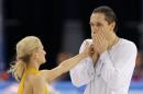 Tatiana Volosozhar and Maxim Trankov of Russia react after they competed in the pairs free skate figure skating competition at the Iceberg Skating Palace during the 2014 Winter Olympics, Wednesday, Feb. 12, 2014, in Sochi, Russia. (AP Photo/Vadim Ghirda)