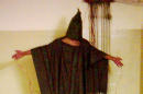 FILE - This late 2003 file image obtained by The Associated Press shows an unidentified detainee standing on a box with a bag on his head and wires attached to him at the Abu Ghraib prison in Baghdad, Iraq. A federal judge ruled Friday, March 20, 2015, that the U.S. must release photographs showing abuse of detainees in Iraq and Afghanistan, following a long-running clash over letting the world see potentially disturbing images of how the military treated prisoners. (AP Photo/File)