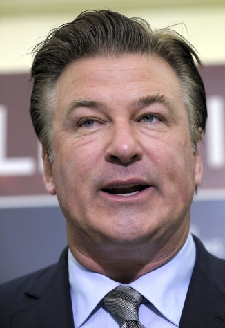 FILE - In this April 6, 2011 file photo, actor Alec Baldwin speaks during a news conference on Capitol Hill in Washington. Baldwin says he was kicked off a plane at Los Angeles International Airport on Tuesday, Dec 6, 2011 after having words with a flight attendant over an "addicting" word game he was playing on his cellphone. (AP Photo/Susan Walsh, File)