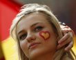 Spanish supporter with a heart in the Spanish colours painted on her cheek waits for the start of the Group C Euro 2012 soccer match between Spain and Italy at the PGE Arena in Gdansk