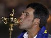 Team Europe captain Jose Maria Olazabal kissees the Ryder Cup after the closing ceremony of the 39th Ryder Cup at the Medinah Country Club