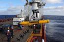 Operators aboard ADF Ocean Shield move Bluefin-21 into position for deployment in the search for MH370 on April 14, 2014