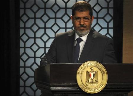 Egypt's President Mohamed Mursi speaks during his first televised address to the nation at the Egyptian Television headquarters in Cairo June 24, 2012. REUTERS/Stringer