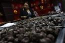 A woman buys chocolate from a store in Polanco neighborhood in Mexico City