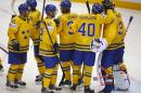 Sweden's players their victory during the Group A preliminary round match against Norway at the Ice Hockey World Championship in Minsk, Belarus, Tuesday, May 13, 2014. (AP Photo/Sergei Grits)