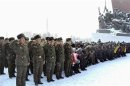 North Koreans pay their respects in front of the statues of the North's founder Kim Il-sung and late leader Kim Jong-il on the first day of new year in Pyongyang