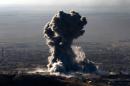 Heavy smoke billows during an operation by Kurdish forces backed by US-led strikes in the northern Iraqi town of Sinjar on November 12, 2015