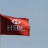 A HSBC flag flutters in Singapore