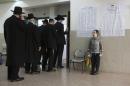 Ultra orthodox Jews line up to vote in Bnei Brak, Israel, Tuesday, March 17, 2015. Israelis are voting in early parliament elections following a campaign focused on economic issues such as the high cost of living, rather than fears of a nuclear Iran or the Israeli-Arab conflict. .(AP Photo/Oded Balilty)