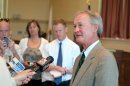 Rhode Island Gov. Lincoln Chafee talks with the media after registering as a Democrat at City Hall in Warwick, RI on Thursday, May 30, 2013. (AP Photo/Joe Giblin)