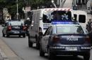 The police-escorted ambulance carrying the remains of late Argentine prosecutor Alberto Nisman heads to the AMIA to be prepared for the funeral according to Jewish rituals, in Buenos Aires, on January 28, 2015