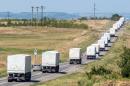 Lorries with a Russian humanitarian convoy approach a checkpoint at the Ukrainian border some 30 km outside the town of Kamensk-Shakhtinsky in the Rostov region, on August 17, 2014