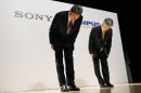 Sony Corp. President and Chief Executive Officer Kazuo Hirai, left, and Olympus Corp. President Hiroyuki Sasa bow together at the end of a joint press conference on their business deal in Tokyo Monday, Oct. 1, 2012. Japan Sony's new alliance with scandal-tarnished Olympus will produce endoscopes and other surgical tools packed with the Japanese electronics and entertainment maker's three-dimensional imagery and super-clear display technology called 4K. (AP Photo/Koji Sasahara)