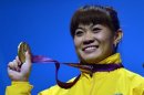 Kazakhstan's Maiya Maneza poses on the podium with her gold medal