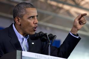 President Barack Obama gestures while speaking at a …