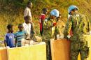 A handout photo received on December 19, 2013 from UNMISS shows officers building latrines for civilians seeking refuge in the UNMISS compound on the outskirts of Juba on December 17, 2013