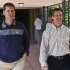 San Francisco 49ers coach Jim Harbaugh, left, walks with his brother John Harbaugh, coach of the Baltimore Ravens, at the NFL football annual meetings Tuesday, March 19, 2013, in Phoenix. (AP Photo/Ross D. Franklin)