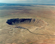 CHANGES SOURCE TO METEOR CRATER, NORTHERN ARIZONA, USA. This undated image courtesy of Meteor Crater, Northern Arizona, USA, shows an aerial view of Meteor Crater, near Winslow, Ariz. The world's best-preserved meteor impact site is an intriguing piece of natural history. Nearly a mile wide and over 550 feet deep, the crater isn't close to being the largest in the world _ Vredefort Dome in South Africa is over 180 miles wide _ but is impressive because limited erosion has left it virtually intact. (AP Photo/Meteor Crater, Northern Arizona, USA.)