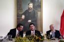 CONMEBOL President Juan Angel Napout, from left, Paraguay's President Horacio Cartes, and FIFA President Sepp Blatter, sit before the start of a luncheon, backdropped by a portrait of past president, Gen. Bernardino Caballero, at the presidential residence in Asuncion, Paraguay, Tuesday, March 3, 2015. The 78-year-old Blatter is seeking a fifth, four-year term running football. (AP Photo/Jorge Saenz)