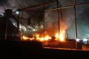 A fire burns at the Moria migrant detention camp on the Greek island of Lesbos following clashes between migrants early on June 2, 2016