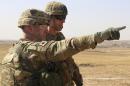 This Oct. 10, 2016 photo released by the U.S. Army shows U.S. Army Lt. Col. Ed Matthaidess, commander, left, Task Force Falcon, outlining areas of an Iraqi security forces tactical assembly area to U.S. Army Maj. Gen. Gary J. Volesky, commander, Combined Joint Forces Land Component Command – Operation Inherent Resolve, in northern Iraq, prior to the start of the Mosul offensive. The U.S. has just as much to gain from the operation to recapture Mosul as the Iraqis themselves. Since 2014, the U.S. has provided airstrikes and advise-and-assist operations to put the beleaguered Iraqi military back on its feet after the Islamic State group gutted it of weapons, supplies and soldiers during its blitzkrieg across Iraq and Syria.(U.S. Army photo by Sgt. 1st Class R.W. Lemmons IV via AP)