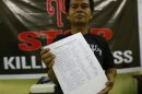 A reporter shows signatures they collected in support of the freedom press law in the Myanmar Journalist Network office in Yangon