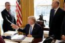 U.S. President Donald Trump shakes hands with Chief Executive Officer of Intel Brian Krzanich the Oval Office of the White House in Washington.