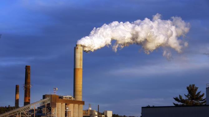 FILE - In this Jan. 20, 2015 file photo, a plume of steam billows from the coal-fired Merrimack Station in Bow, N.H. President Barack Obama on Monday, Aug. 3, 2015, will unveil the final version of his unprecedented regulations clamping down on carbon dioxide emissions from existing U.S. power plants. The Obama administration first proposed the rule last year. Opponents plan to sue immediately to stop the rule&#39;s implementation. (AP Photo/Jim Cole, File)