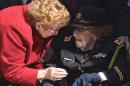 Army Lt. Col. Luta C. McGrath, 107, the oldest known female World War II veteran, right, is greeted as she is recognized by President Barack Obama during Veterans Day ceremonies, Wednesday, Nov. 11, 2015, at the Memorial Amphitheater of Arlington National Cemetery in Arlington, Va. (AP Photo/Susan Walsh)