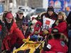 Former Iditarod winner Mitch Seavey is hugged by his wife, Janine, before he takes part in the official restart of the Iditarod Race in Willow